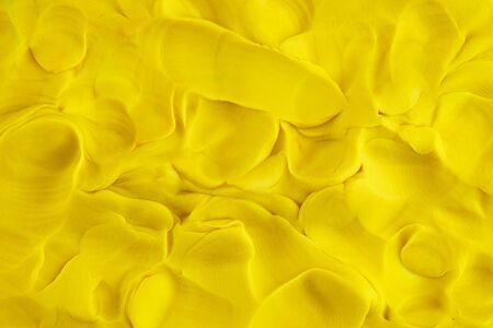 Play clay yellow background texture. Close up.の写真素材