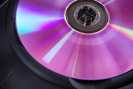 Back side of a dvd disÑ with some dust.の写真素材