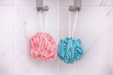 Pink and blue shower scrubbers. Close up.の写真素材