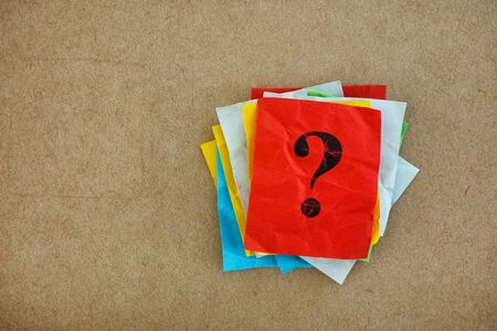 Pile of colorful paper notes with question marks. Closeup.の写真素材