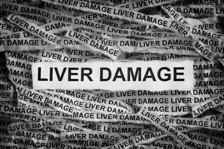 Liver Damage. Torn pieces of paper with the words Liver Damage. Concept Image. Black and White. Closeup.の写真素材