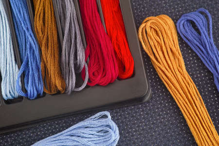 Colorful cross stitch embroidery threads. Close up.