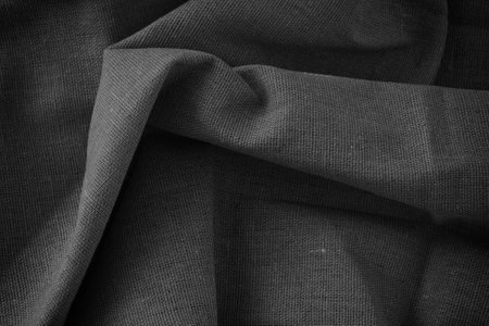 Folded fabric texture background. Black and white. Close up.の写真素材