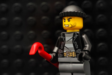 Tambov, Russian Federation - January 13, 2021 Lego robber minifigure with a red crowbar.のeditorial素材