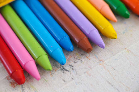 Colorful crayons sticking out of a box. Close up.