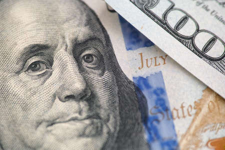 Benjamin franklin on a one hundred dollar bill. Close up.
