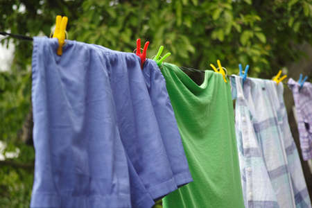 Clothes hanging on a clothes line. Close up.の写真素材