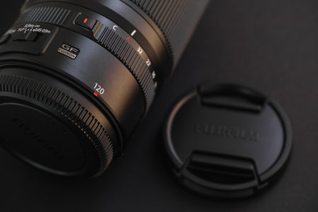 Tambov, Russian Federation - June 28, 2021 Fujifilm Fujinon GF 120mm f / 4 R LM OIS WR Macro Lens on a black background. Close up.のeditorial素材