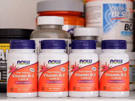 Tambov, Russian Federation - February 05, 2022 Bottles of vitamin D3 by NOW on a shelf with some other supplements behind them.のeditorial素材