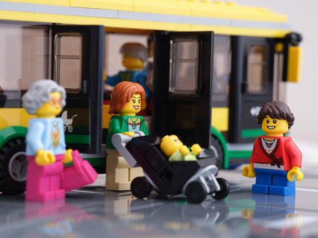 Tambov, Russian Federation - February 16, 2022 A Lego woman minifigure exiting from a bus with a...