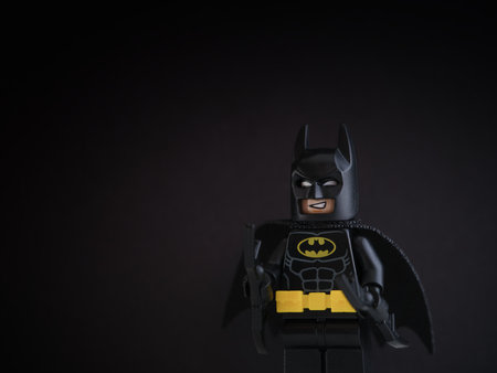 Tambov, Russian Federation - October 09, 2022 A portrait of a Lego Batman minifigure standing against a black background.のeditorial素材
