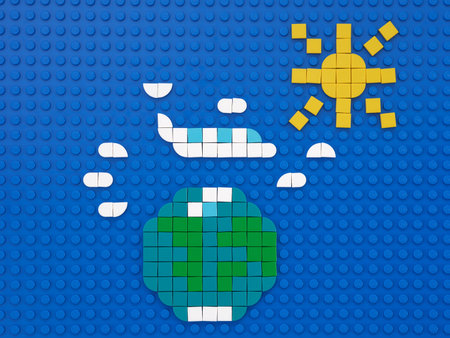 Tambov, Russian Federation - June 14, 2022 A plane flying around the world through the clouds. The scene is made out of Lego dots.のeditorial素材