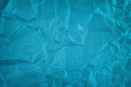 A crumpled blue paper background. Close up.の写真素材