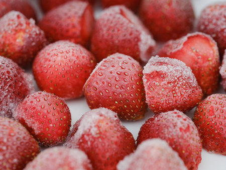 A background of frozen strawberries. Close up.の写真素材