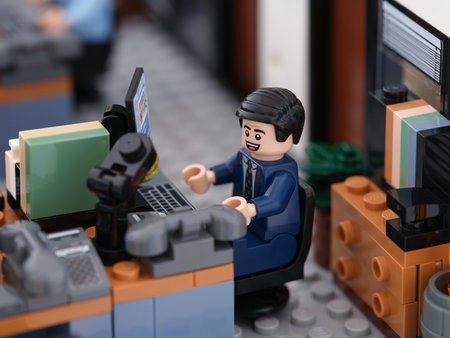 Tambov, Russian Federation - June 24, 2023 A Lego businessman minifigure working on a computer in an office. Close up.のeditorial素材