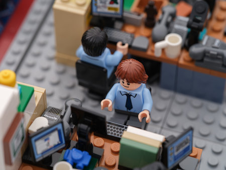 Tambov, Russian Federation - September 26, 2023 Two Lego businessman minifigures working on computers in an office. Close up.のeditorial素材