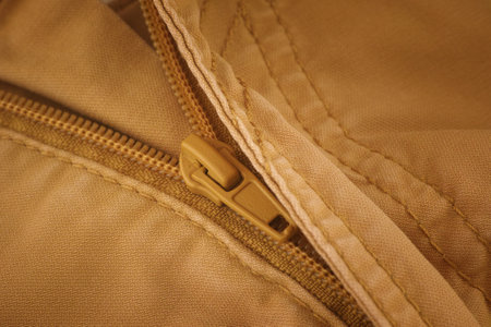The zipper on beige pants. Close up.の写真素材