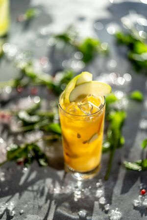 Cocktail Cobler with apple slices street bokehの写真素材