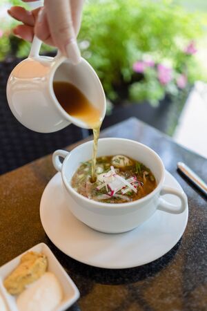 Russian cold soup okroshka on summer terraceの写真素材