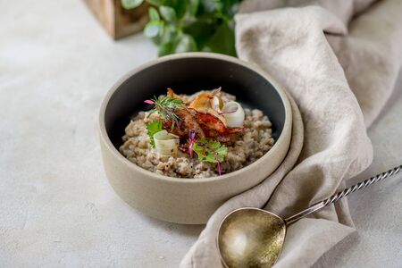 Buckwheat with vegetables greens with kithchen towel spoon leaf cafe restaurant cuisine daylightの写真素材