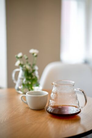 Black filter coffee on the table in cafe service kettle hario pour over cup side viewの写真素材