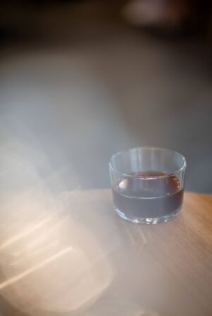 Black filter coffee on the table in cafe glass cup hario pour over cup side viewの写真素材