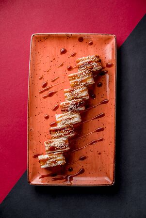 Sushi rolls eel rice fish salmon nori cuisine cafe restaurant top viewの写真素材