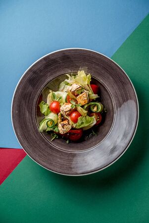 Salad vegetables cucumber tomato pepper tofu sauce salted traditional cuisine top viewの写真素材