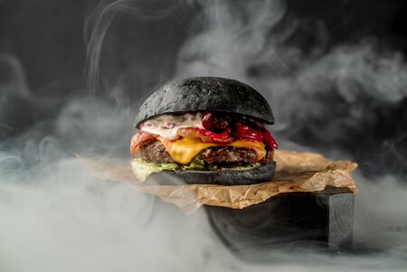 Beef burger american cuisine tomato bbq meat cooking cafe restaurant smoke side viewの写真素材