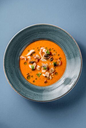Tom yam soup vegetables shrimp mushroom microgreen asian cuisine cooking  top viewの写真素材