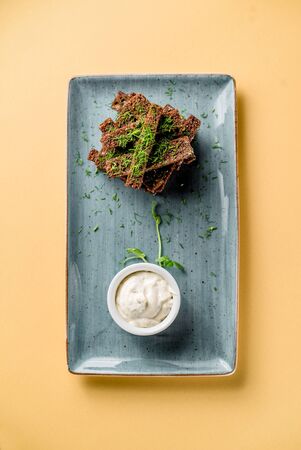 Plate with garlic toast sauce microgreen snak salt salted cuisine top viewの写真素材