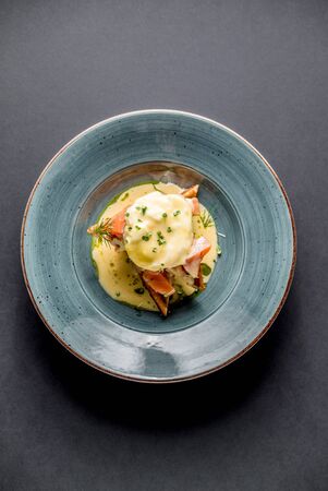Toast with salmon path egg hollandise sauce green cafe dish restaurant top viewの写真素材