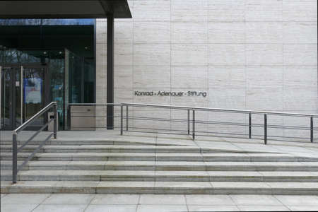Berlin, Germany, March 28, 2021, entrance area of the Konrad Adenauer Foundation in Berlin Tiergarten, with poster in the entrance area that says: "The political opinion - New culture wars? Ways out of polarization"のeditorial素材