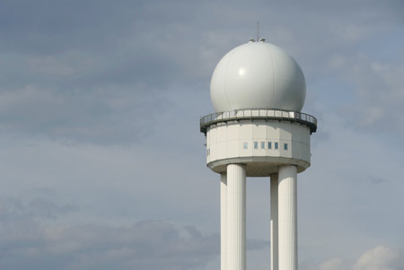 Berlin, Germany, April 21, 2021, radar tower at the former Tempelhof Airport against a cloudy sky.のeditorial素材