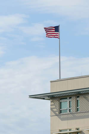 Berlin, Germany, April 16, 2021, flag with stars and stripes on the US Embassy in Berlin near the Brandenburg Gate.のeditorial素材