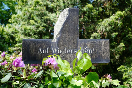 Berlin, Germany, June 2, 202, gravestone with original inscription: "Auf Wiedersehen" ("Goodbye")のeditorial素材