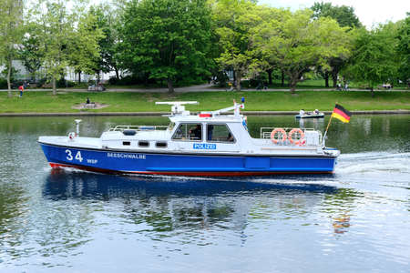 Berlin, June 2, 2021, "Seeschwalbe" ("Lake swallow"), boat of the water police on the Landwehr Canal on the heights of Urbanhafen in Kreuzberg.のeditorial素材