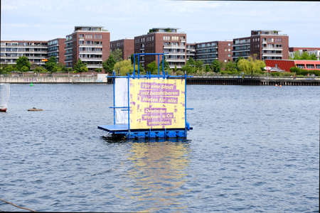 Berlin, Germany, June 1, 2021, floating installation with the inscription: "For a city with affordable rents for all. Expropriate Deutsche Wohnen and Co."のeditorial素材