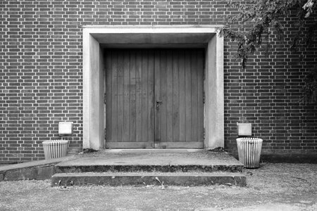 Frontal view of the entrance area of a funeral hall in black and white.の写真素材