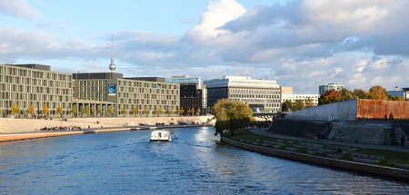 Berlin, Germany, October 23, 2021, view over the river Spree to the Kapelle Ufer with the buildings of the Federal Ministry of Education and Research, the Federal Press Conference and the TV Tower in the background.のeditorial素材