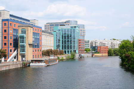 Berlin, Germany, May 10, 2022, view over the river Spree to the ensemble of buildings in Moabiter Spreebogen with Abion Hotelのeditorial素材