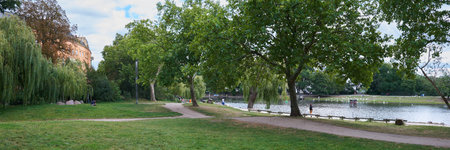Berlin, Germany, August 25, 2025, local recreation park on the site of the former LuisenstÃ¤dter Canal, now filled in, with a residential building on Fraenkelufer in the background.の写真素材