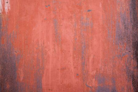 Red piece of rusted iron. Horizontal shot.