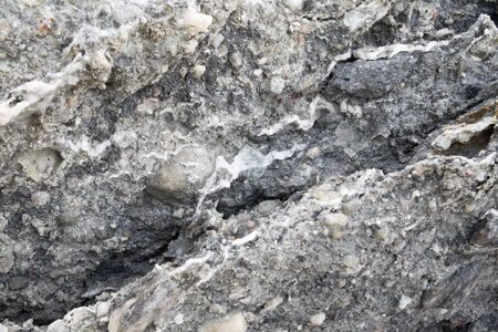 Grey rock background. Vertical shot.