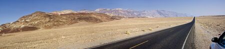 Car on the side of a road in California, United States. Panoramic shot.の写真素材