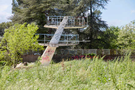 Abandoned swimming pool turned into wasteland
