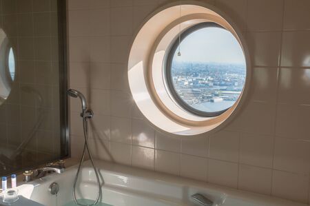 View from the bathroom of the beautiful urban landscape high density city skyline.
