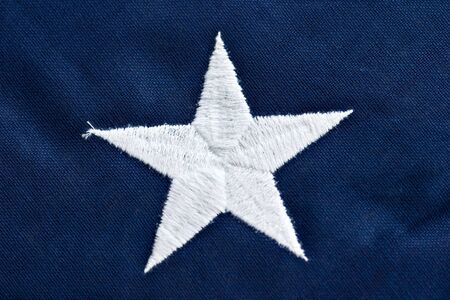 Close up of a star on an American flag.