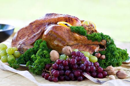 Roasted turkey on holiday table ready to eat.の写真素材