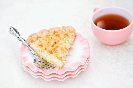 Coconut pie with tea in background. Shallow DOF.の写真素材